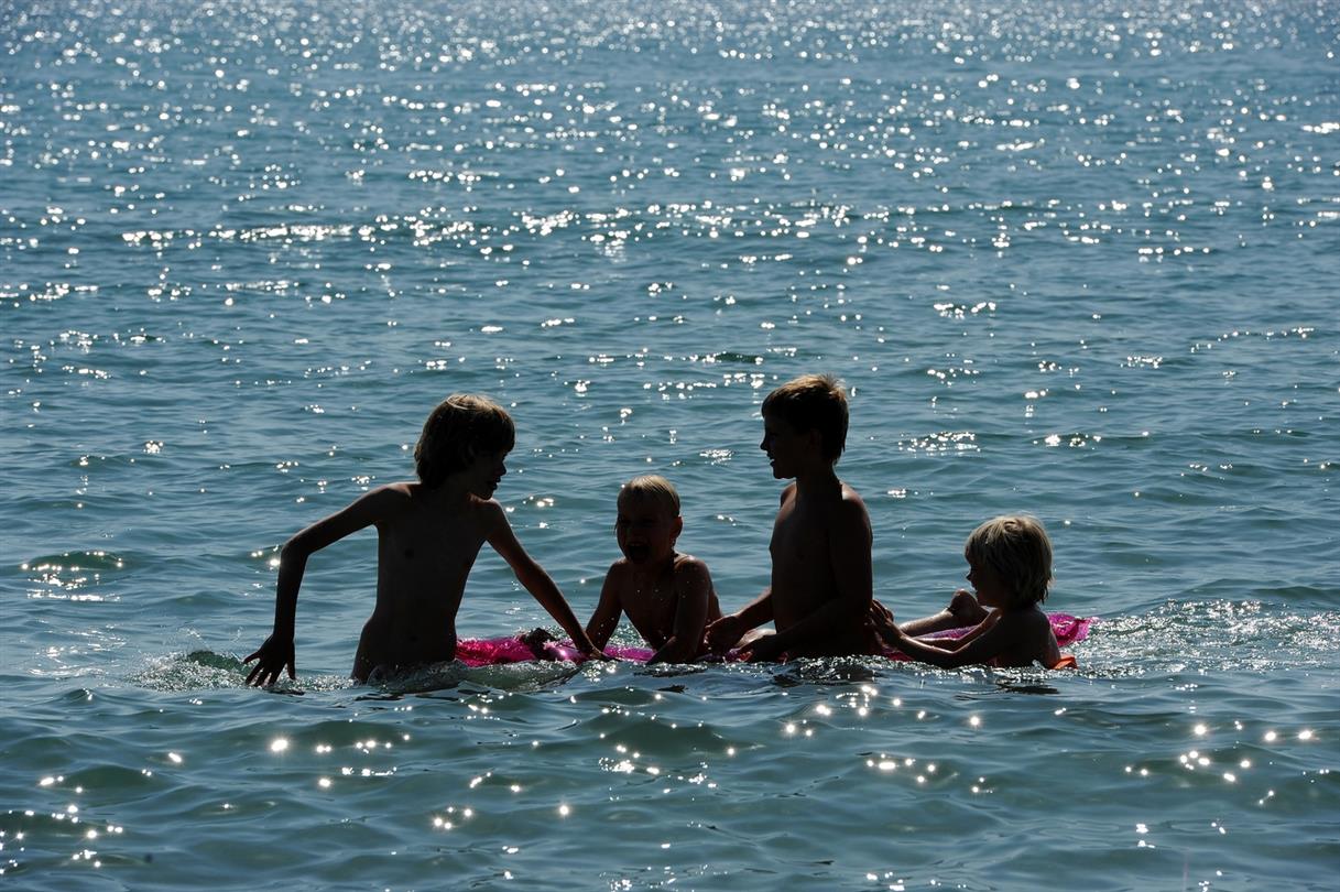 Swimming in the sea - Corsica naturist campsite by the sea