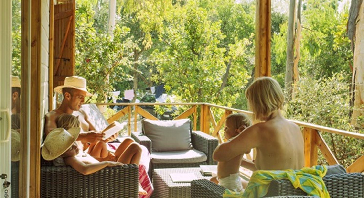  Family holidays, Chalet terrace in your naturist campsite in Corsica